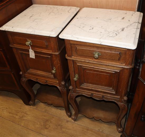 A pair of 19th century French oak bedside cabinets W.40cm